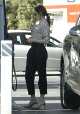 Rose seen filling her car up with gas at a gas station in Los Feliz, CA - March 2, 2012