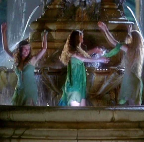 A Trio of Nymphs frolic about in a fountain after being flushed from the forest