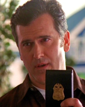 Jackman displays his badge to the sisters