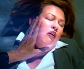 Eames absorbs Natalie's powers as she dies