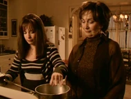 Penny watches Piper add ingredients to the potion