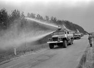 This truck is spraying the trees with water to keep down radioactive dust.