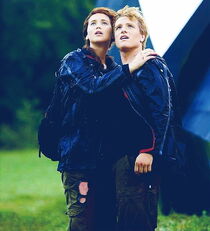 Winners Katniss and Peeta wait for a hovercraft to pull them up