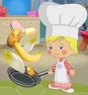 Chloe as a chef with a pan of food