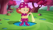 Tara in her raingear (Rainbow Riddle and Amid the Pyramids (real-life scenes))
