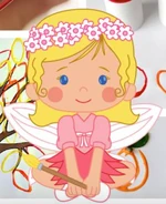 Chloe as a fairy sitting down