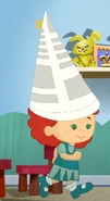 Tara in her paper hat (We Ought to Be in Movies)