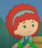 Tara (in real life) with a green scarf (Icing Escapades)