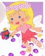 Chloe as a fairy holding onto a bunch of flowers