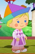 Chloe in her re-decorated artist smock with a triangular kite hat (Fashion Fantasy)