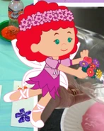 Tara as a fairy with a bunch of flowers
