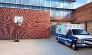 Exterior with Ambulance and Basketball Hoop (day)