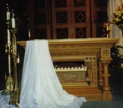 The main, free-standing altar of , . The original high altar is behind the screen. This altar contains a reliquary holding the remains of , a Roman Catholic  and  killed during the persecutions of the Roman Emperor .