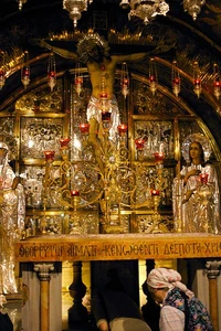 The  at Golgotha. Pilgrims are bowing down to kiss the star which marks the traditional spot where the Cross of Jesus was planted.