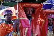 A priest is holding a  in a Timket (Epiphany) ceremony at Gondar, Ethiopia, at which water will be blessed.