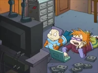 All Grown Up! - The Finster Who Stole Christmas 24.png (1.59 MB) Chuckie showing Tommy his family's home movies of past Christmases.
