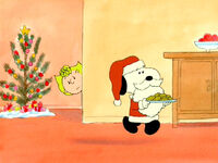 Snoopy taking some cookies that Sally left for Santa. (Charlie Brown's Christmas Tales)