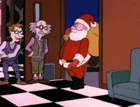 Drew welcomes (what he thinks is the professional actor playing) Santa.