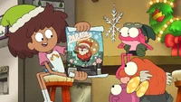 Anne shows a flyer for the Christmas-Palooza parade.