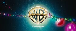The Warner Bros. shield covered in snow and decorated with Christmas lights (seen at the beginning of ).