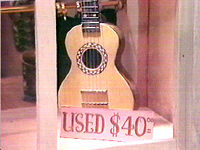 A guitar with mother-of-pearl inlays