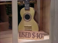 A guitar with mother-of-pearl inlays