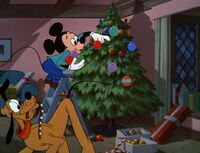 Mickey decorating his tree.