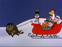 Taz pulls Bugs and the gang in a sleigh.