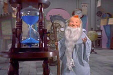 Father Time look at hourglass