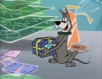 While everyone's away, Astro finds his present under the tree.