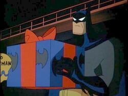 Batman holding a gift box