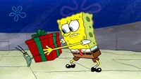 SpongeBob doesn't want Plankton to see Santa's gift.