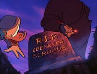 Pete shows Scrooge his own grave