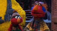 Elmo with his father, Louie, in Once Upon a Sesame Street Christmas