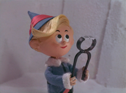 Hermey holding a teeth puller