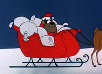 Taz lands in Santa's sleigh.