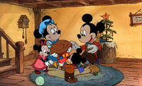 Mickey with Minnie (as Mrs. Cratchit), Ferdie (as Peter Cratchit), and Melody (as Martha Cratchit) at the end of Mickey's Christmas Carol.