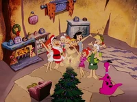 The families singing "We Wish You a Merry Christmas".