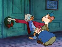 Scrooge turns down Ratty and Mole's soliciting.