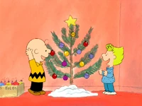 Sally and Charlie Brown decorating a tree in Charlie Brown's Christmas Tales.