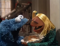 Cookie Monster eat the cookies that Janice baked.