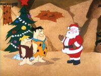 Santa congratulates Fred and Barney