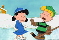 Lucy tries to get Schroeder's attention. (Charlie Brown's Christmas Tales)