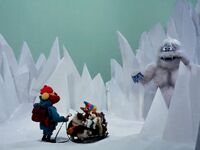 The Abominable Snowmonster pursues Rudolph, Hermey, and Yukon.