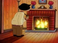 Mr. Hyunh staring at the fireplace