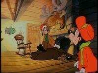 Goofy mistakes a bear for a rug.