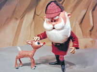 Santa meets newborn Rudolph.