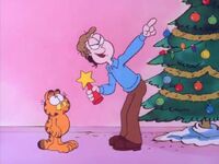 Jon assigns Garfield to put the star up