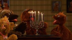 Bear family celebrating Hanukkah
