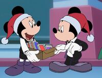 Minnie brings out a box of Christmas cartoons